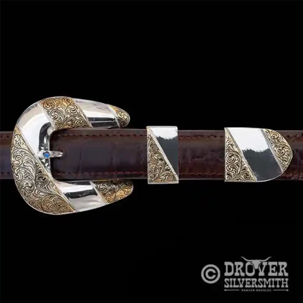 Step into luxury with The Saloon Keeper Sterling Silver Buckle Set, a half hand engraved half polished set featuring multiple jeweler's bronze strips in the buckle, tip and loop.  Add a second loop for a ranger buckle set now!